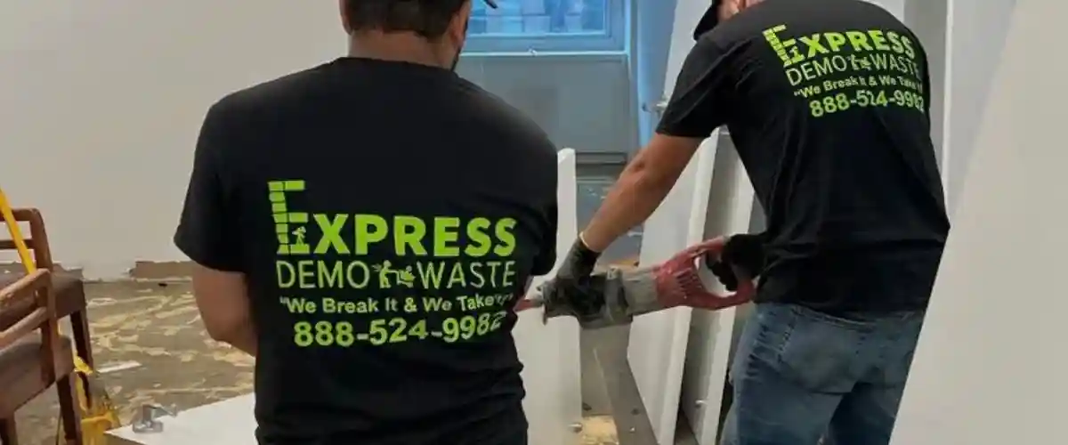 Two workers working for interior decoration wearing black t-shirts
